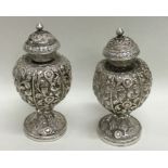 A heavy pair of Indian silver salts decorated with