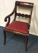 A Dutch marquetry carver chair with slip-in seat.