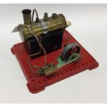 A Mamod steam engine on red base with burner. Est.