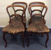 A set of four Victorian mahogany hoop back chairs