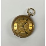 A lady's 18 carat fob watch with loop top and gilt