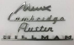 Four chrome vintage car badges comprising "Austin"
