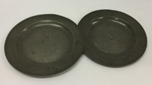 Two Antique pewter plates. Est. £10 - £15.