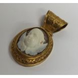 A high carat gold cameo pendant depicting winged i