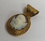 A high carat gold cameo pendant depicting winged i