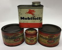 Three "Mobil" grease cans together with a "Mobil" oil