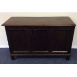 An oak carved front coffer with hinged top. Est. £