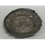 An Indian silver basket decorated with figures. Ap