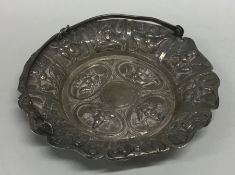 An Indian silver basket decorated with figures. Ap