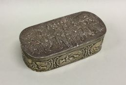 An oval Dutch silver box profusely decorated with