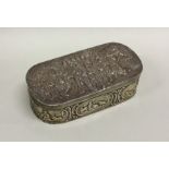 An oval Dutch silver box profusely decorated with