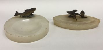 Two onyx and cast bronze ashtrays mounted with Kin