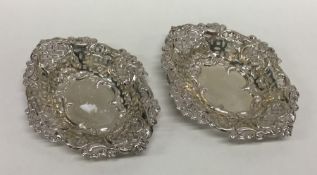 A pair of Edwardian silver bonbon dishes with scro