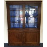 A small Georgian four door mahogany bookcase, the