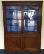 A small Georgian four door mahogany bookcase, the