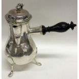 An early Georgian French(?) silver coffee pot on t