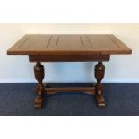 An oak drawer leaf table with plank top and stretc