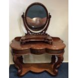 A mahogany serpentine dressing chest together with