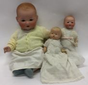 Two porcelain headed German dolls together with on