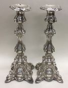 A pair of good tall Continental candlesticks decor