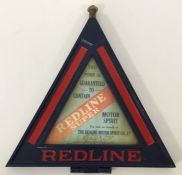 A triangular metal and glass double-sided "Redline