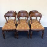 A set of six mahogany balloon back chairs with ins