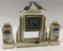 An Art Deco mantle clock mounted with two love bir