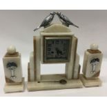 An Art Deco mantle clock mounted with two love bir