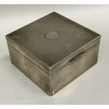 A silver engine turned cigarette box with hinged t