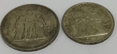 A silver 50 Franc together with a silver 10 Franc.