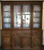 A massive mahogany four door break front secretaire bookcase,