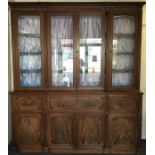 A massive mahogany four door break front secretaire bookcase,