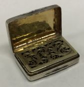 A Georgian silver vinaigrette with pierced gilt in