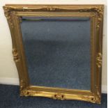 A gilt framed mirror. Approx. 59 cms x 70 cms. Est