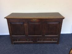 A large oak two drawer hinged top mule chest. Est.