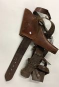 A good leather and brass mounted pistol holster. E
