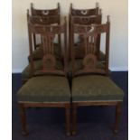 A set of six carved oak Edwardian dining chairs. E