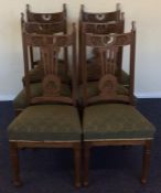 A set of six carved oak Edwardian dining chairs. E
