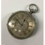 A large silver open face pocket watch with silvere
