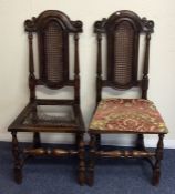 A pair of George I style oak hall chairs on turned