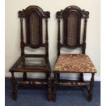 A pair of George I style oak hall chairs on turned