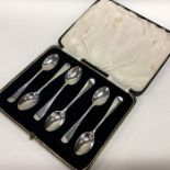 A boxed set of six OE coffee spoons with tapering