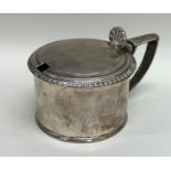 A good large Georgian silver mustard with hinged t