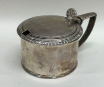 A good large Georgian silver mustard with hinged t