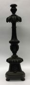 A large Gothic candle holder with carved decoratio