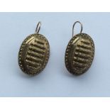 A pair of unusual gold ear pendants with ball deco