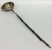 A Georgian silver mounted toddy ladle inset with b