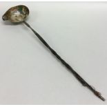 A Georgian silver mounted toddy ladle inset with b