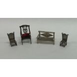 A group of four novelty miniature silver chairs of