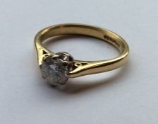 A large diamond single stone mounted as a ring in